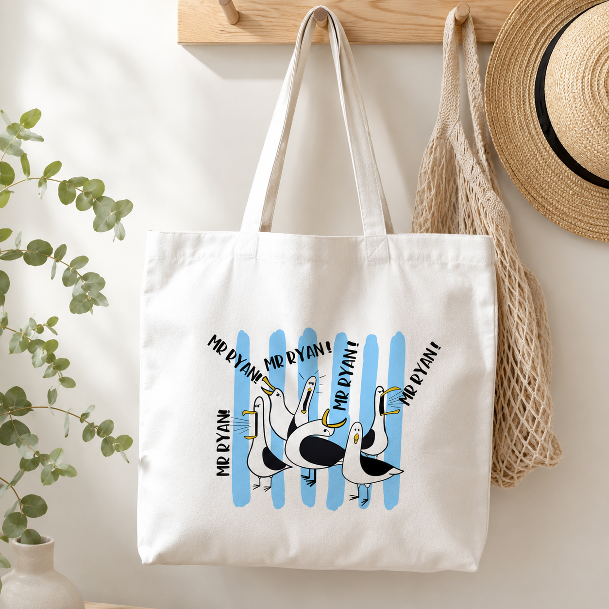 Personalised teacher tote bag with custom name design hanging on wall hook