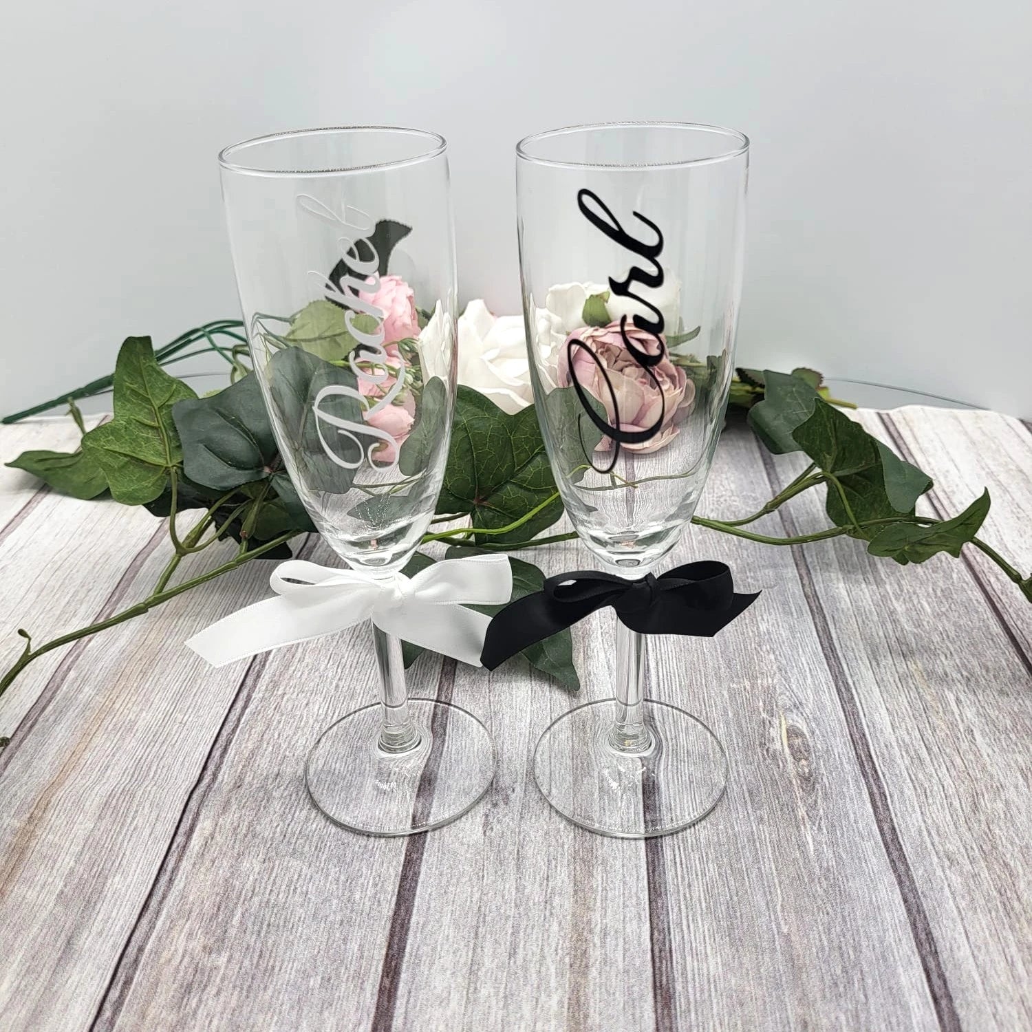 Personalised wedding champagne flutes with black and white satin ribbons, names “Rachel” and “Carl”, handcrafted in Co. Meath Ireland.