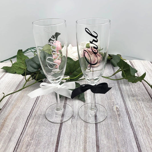 Personalised wedding champagne flutes with black and white satin ribbons, names “Rachel” and “Carl”, handcrafted in Co. Meath Ireland.