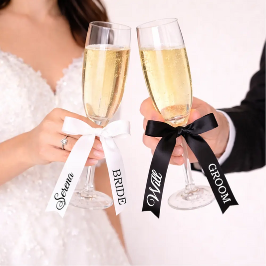 Personalised satin wedding ribbons with names and titles used on champagne flutes, napkins and bridal party accessories, handmade in Ireland