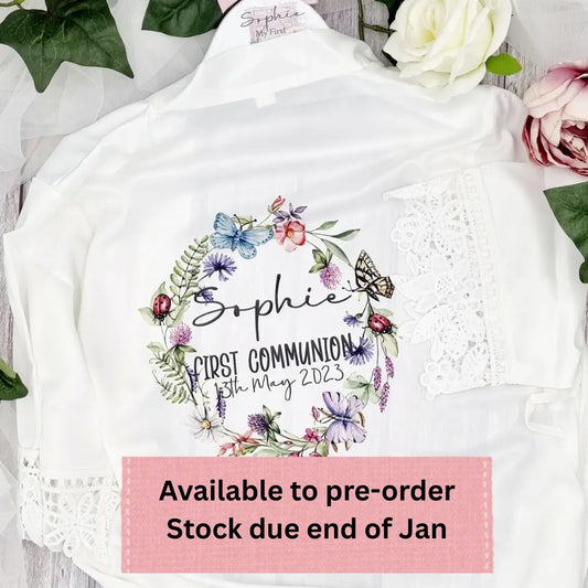 Personalised white First Communion robe with floral wreath design, child’s name and Communion date
