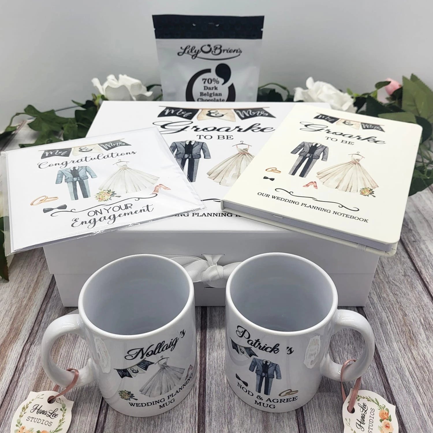 Full wedding planning gift set including a personalised keepsake box, wedding planning notebook, engagement card, chocolates and matching mugs.