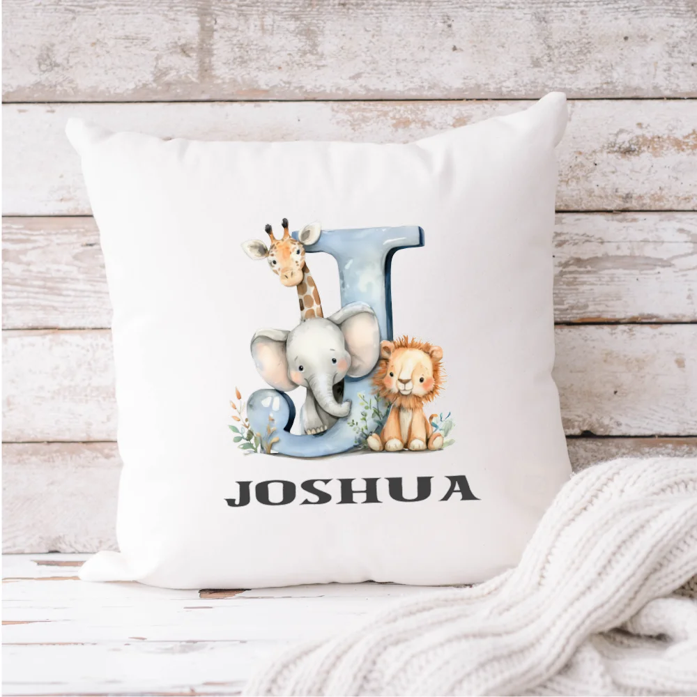 Personalised baby boy initial cushion with blue safari animals – elephant, giraffe and lion – handmade in Ireland by HanaLee Studios