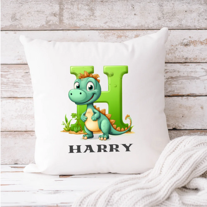 Personalised dinosaur cushion with the name Harry – green dinosaur design on white cushion, Irish-made
