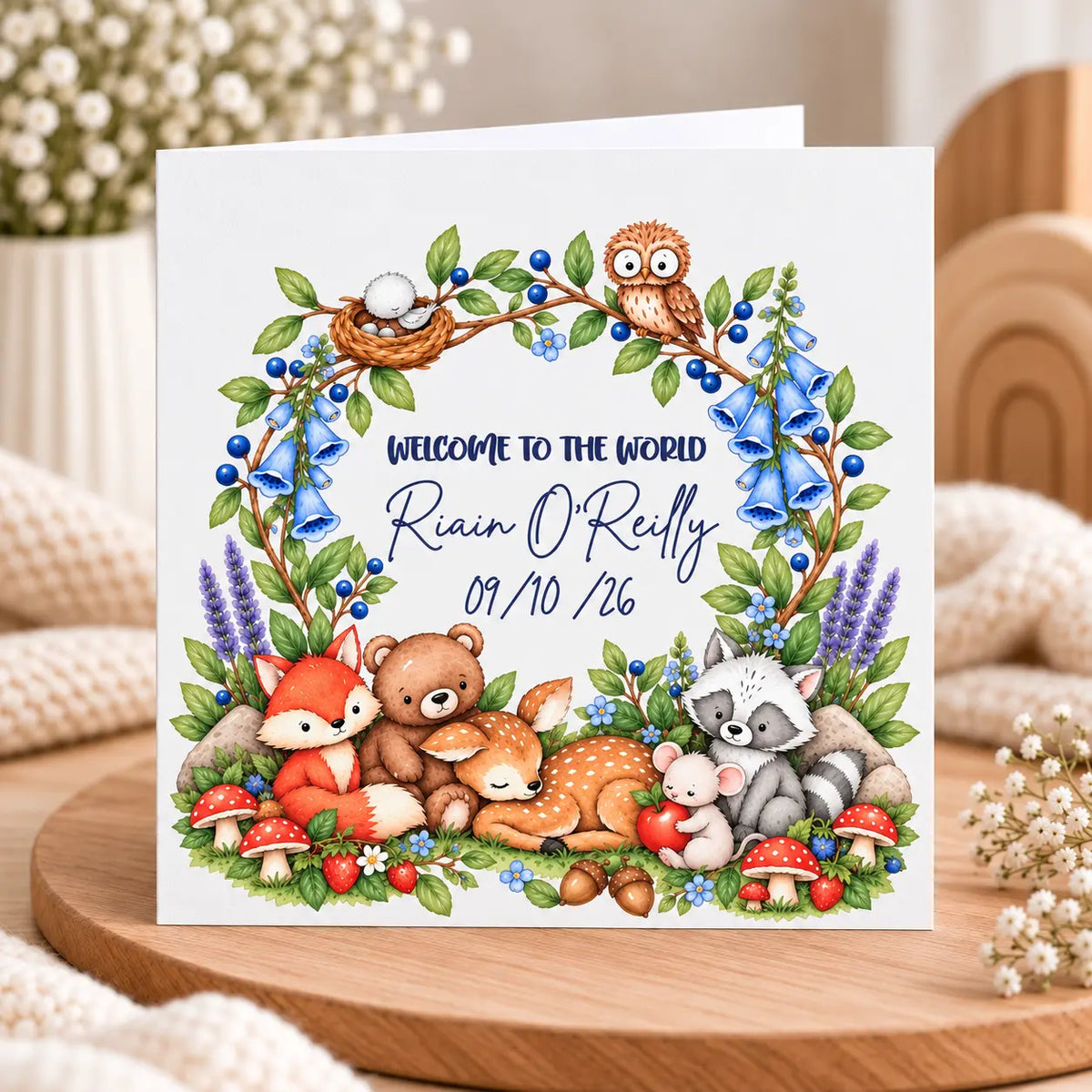 Personalised 6x6 inch Welcome to the World baby card with name, birth date and blue woodland flowers, fox, deer, bear, owl and raccoon.
