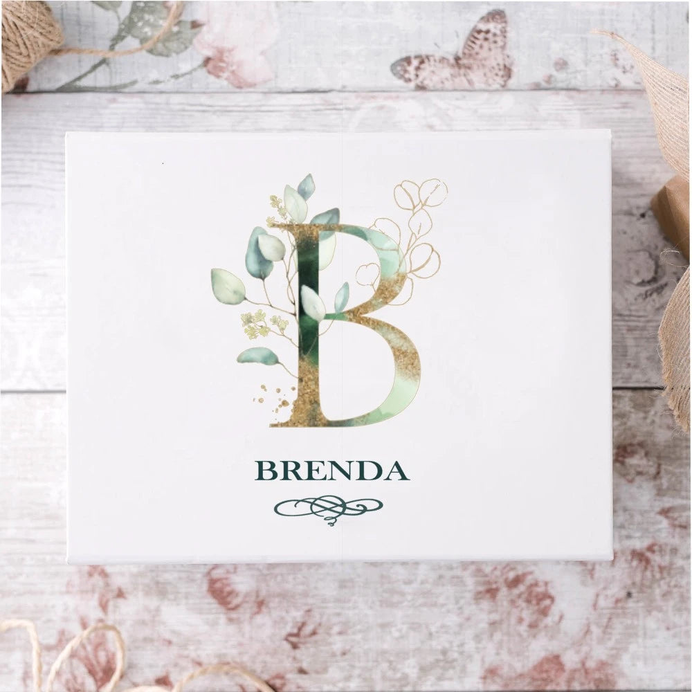 Beautiful white bridesmaid proopsal gift box with gold and green initial and name  underneath. 