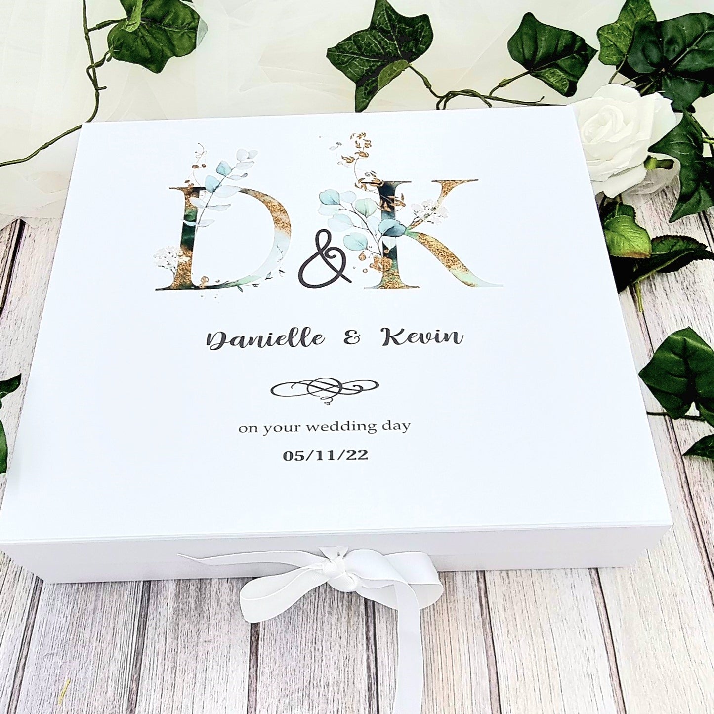 Beautiful personalised large white memory keepsake box for wedding couple. Design features pretty initial letters as well as details such as names and date. 