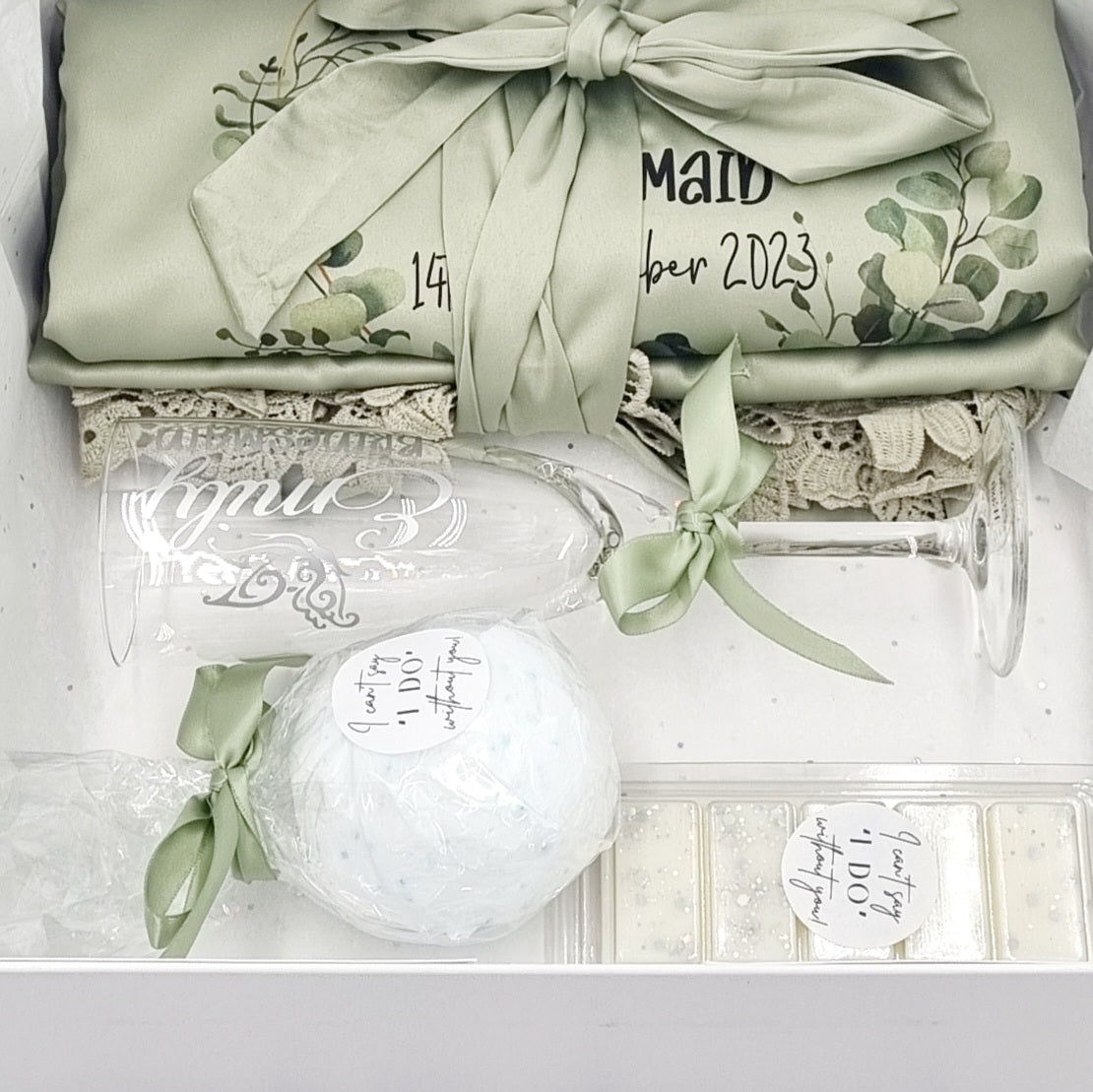 Heavenly scent gift set with white personalised luxury gift box with eucalyptus wreath design and matching sage green robe, bath bomb and wax melt. 