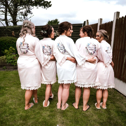 Blush pink robes with butterfly wreath design robes and personalised with names and titles