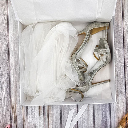Storage box for wedding veil and shoes. Beautiful white luxury box with wedding design on front and tie ribbons. 