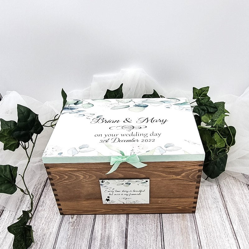 Beautiful wooden wedding keepsake box personalised with couples name on the top and wedding date. 
