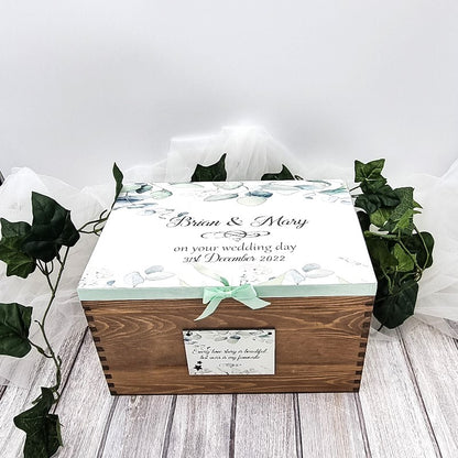 Beautiful wooden wedding keepsake box personalised with couples name on the top and wedding date. 