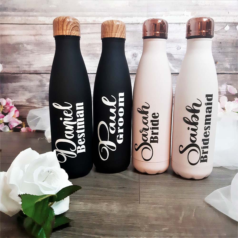 BLack and pale pink drink bottles with name and title